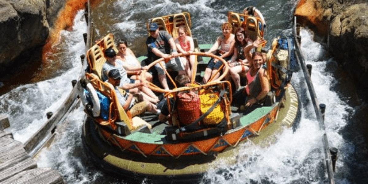 Folks Getting Soaked on Kali River Rapids Attraction